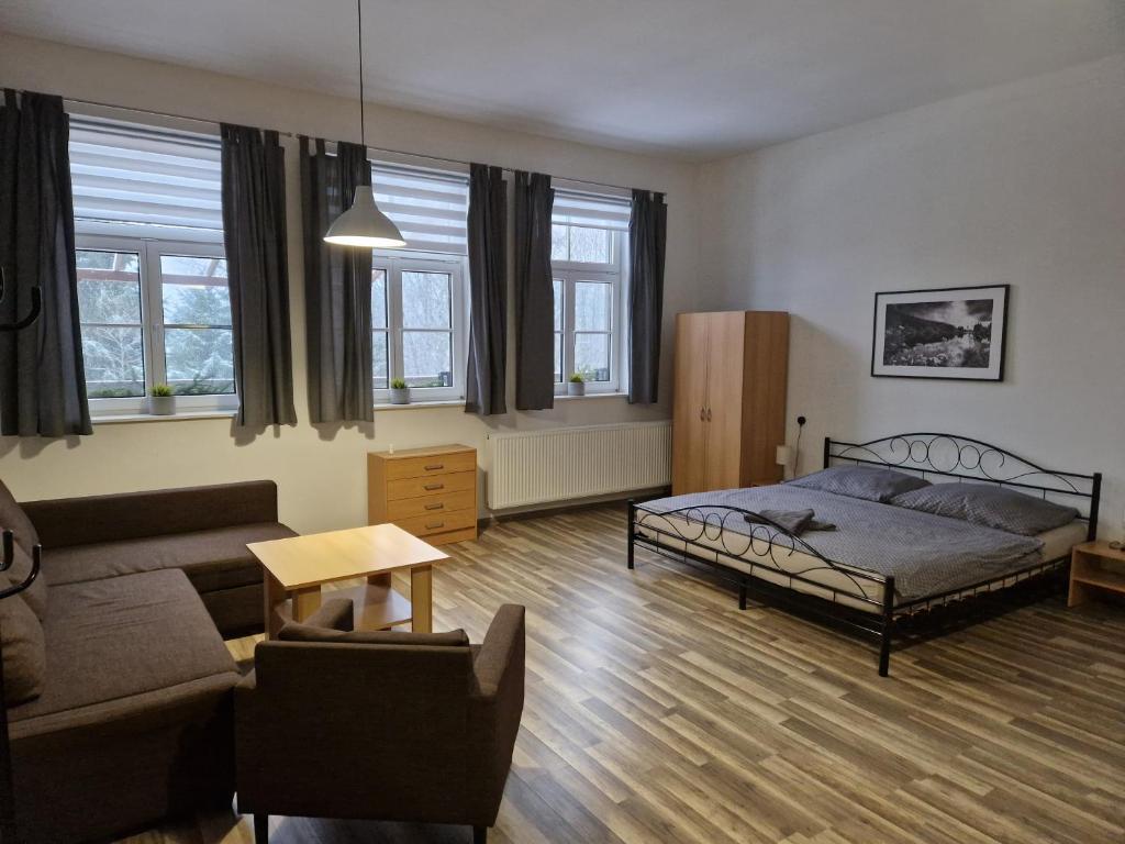 Postel nebo postele na pokoji v ubytování Apartmány Obora