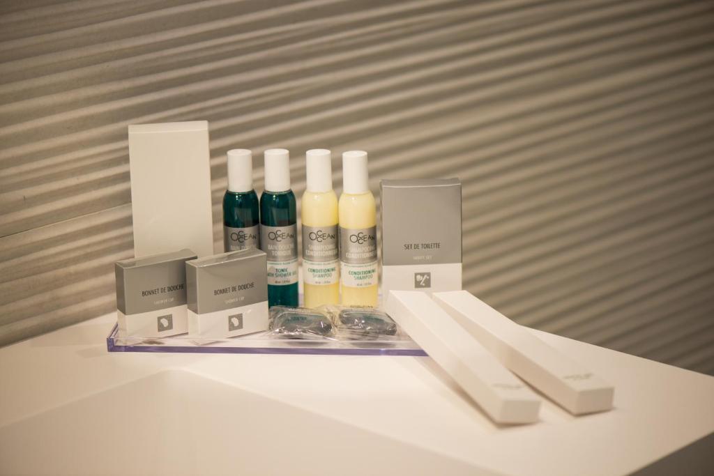 a white table with bottles of cosmetics on it at Hotel Cicò in Torre Santa Sabina