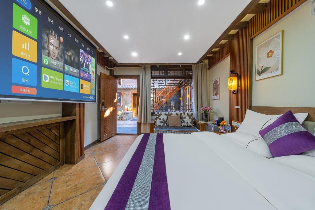 Postel nebo postele na pokoji v ubytování Yingxueke King Room