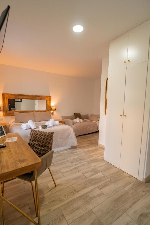Posteľ alebo postele v izbe v ubytovaní Center Suites San Eloy