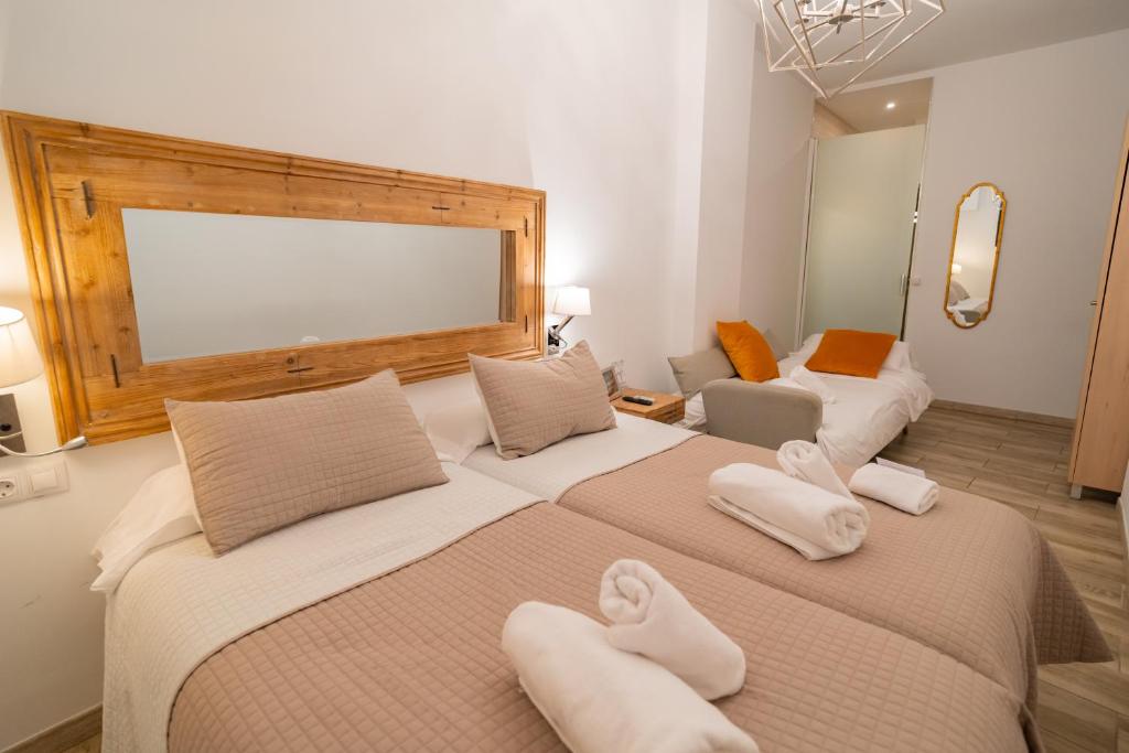 Posteľ alebo postele v izbe v ubytovaní Center Suites San Eloy