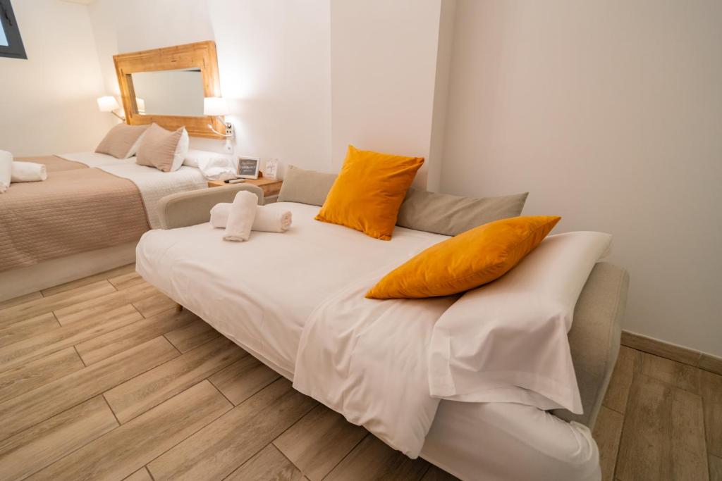 Posteľ alebo postele v izbe v ubytovaní Center Suites San Eloy