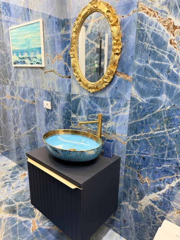 a bathroom with a sink and a mirror at Relax assoluto in Cremona