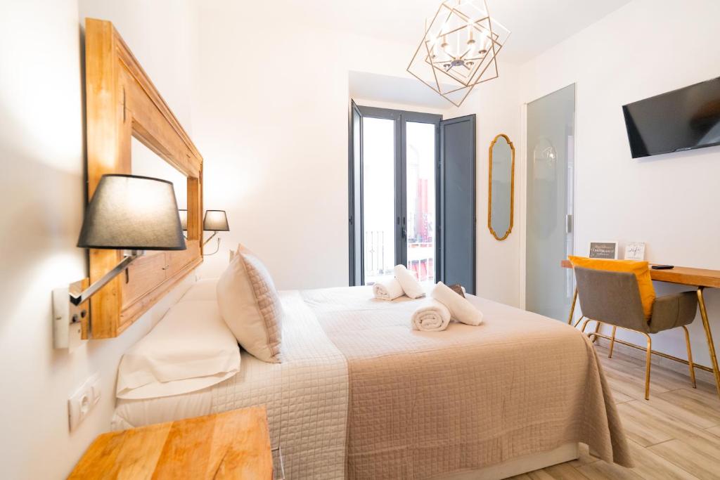 Posteľ alebo postele v izbe v ubytovaní Center Suites San Eloy