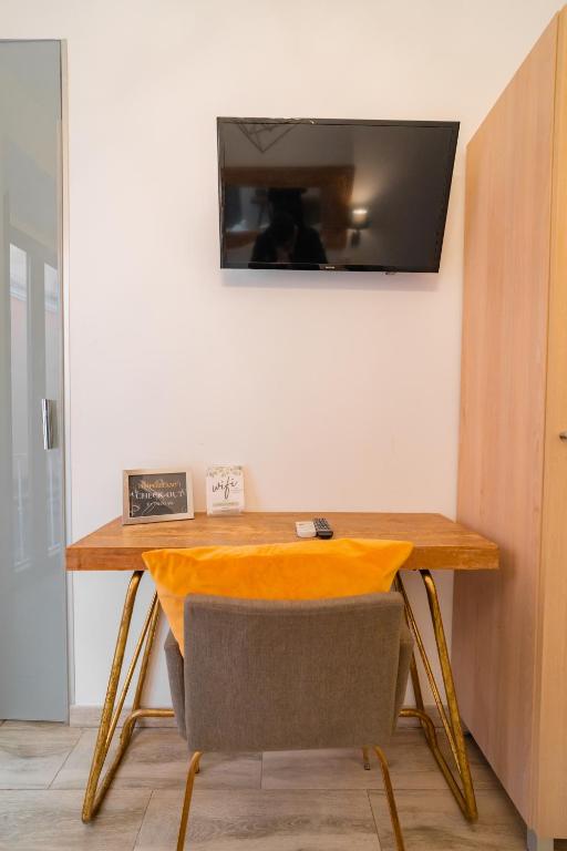 Televízia a/alebo spoločenská miestnosť v ubytovaní Center Suites San Eloy