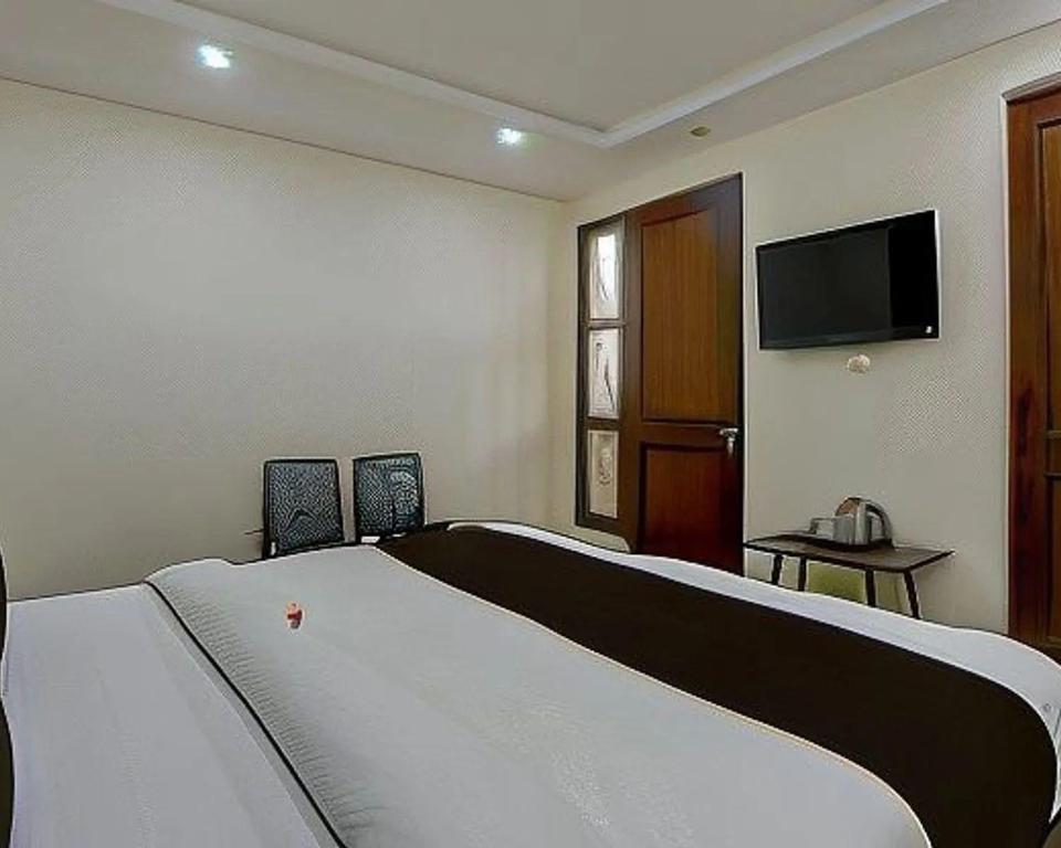Postel nebo postele na pokoji v ubytování Hotel Fab Green Inn