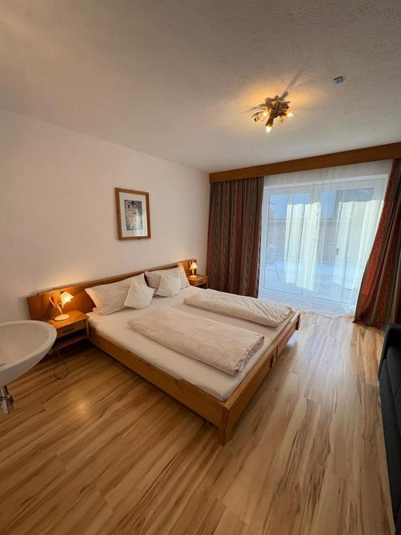 Posteľ alebo postele v izbe v ubytovaní Haus Evi
