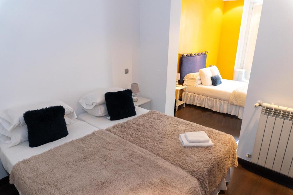 Postel nebo postele na pokoji v ubytování Hostal Santo Domingo