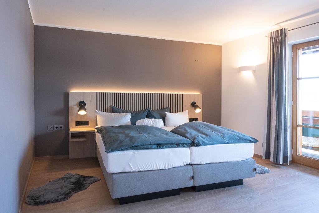 Postel nebo postele na pokoji v ubytování Nebelhorn Relaxhotel