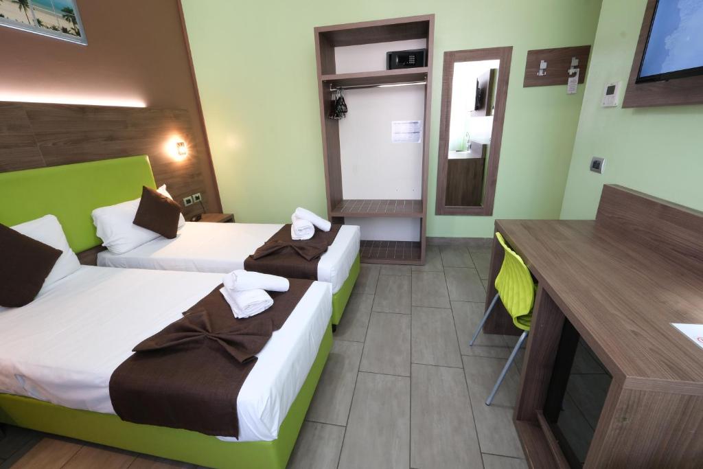 Postel nebo postele na pokoji v ubytování Hotel Giacosa