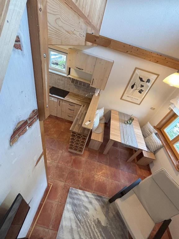 an overhead view of a kitchen in a tiny house at Familienchalets am Millstätter See in Rothenthurn