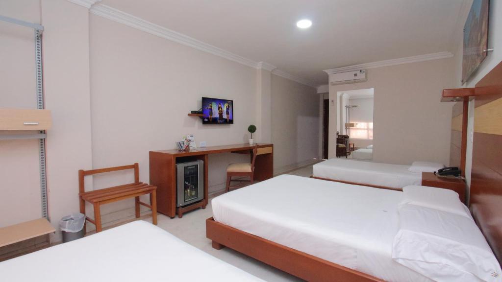 Postel nebo postele na pokoji v ubytování Hotel Genova Centro