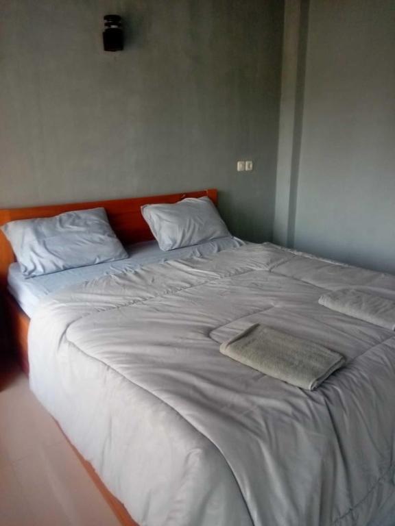 A bed or beds in a room at NURBATA HOLDING'S Hostel