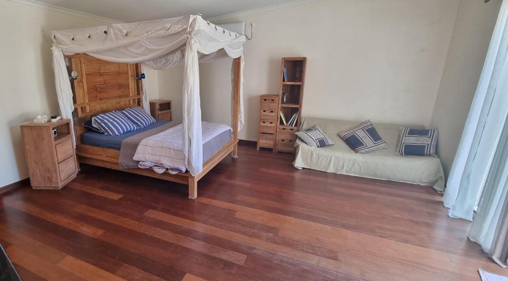 Postel nebo postele na pokoji v ubytování Poé Lodge - Une parenthèse au paradis