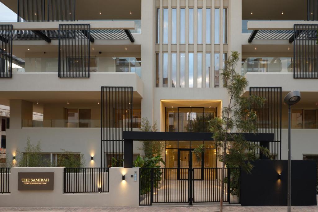 a facade of a building with black fence at The Samirah Luxury Residences in Elliniko in Athens