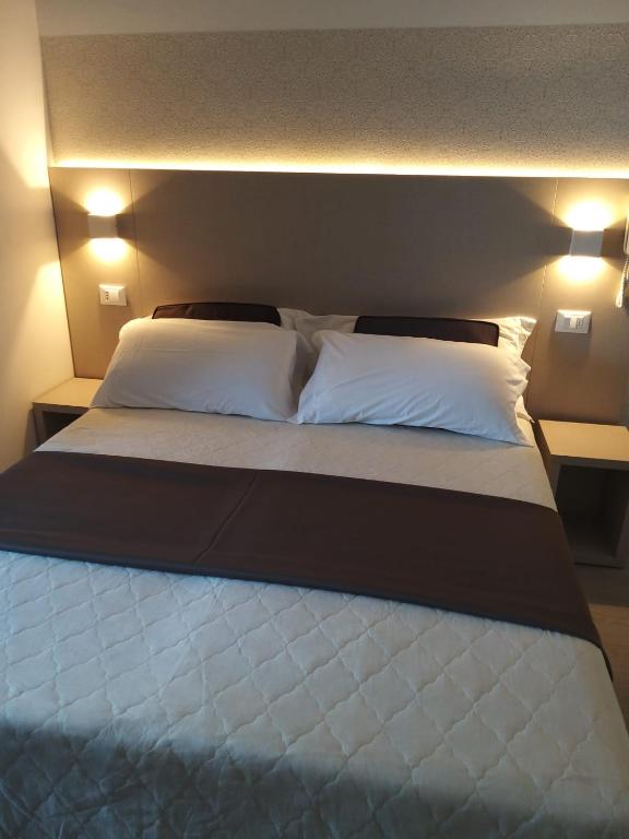 Postel nebo postele na pokoji v ubytování Hotel Ideal