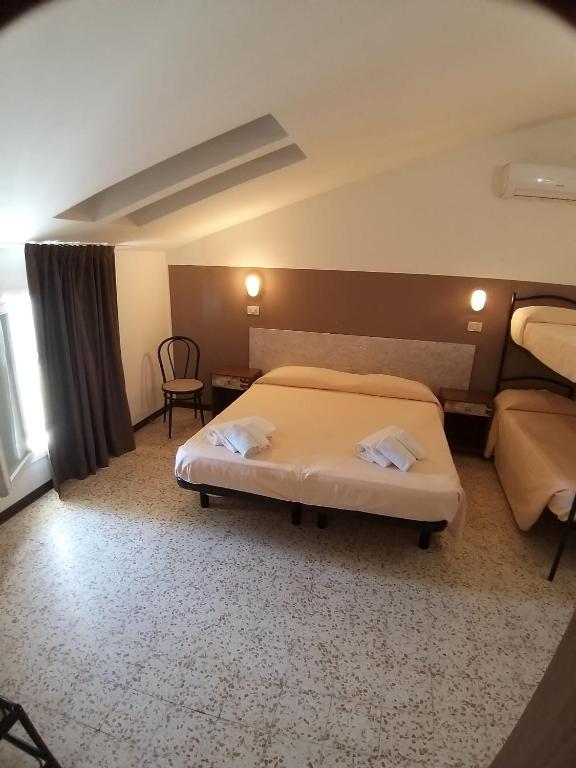 Postel nebo postele na pokoji v ubytování Hotel Ideal