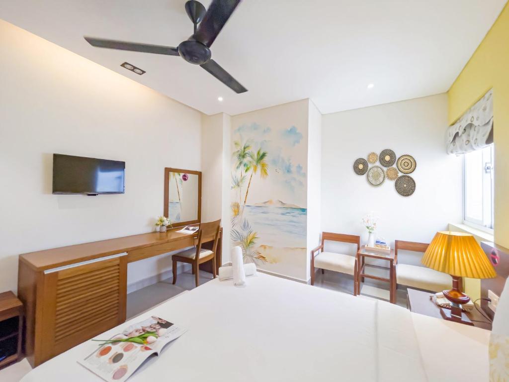 Giường trong phòng chung tại Doha Central Bliss Danang Hotel by Haviland