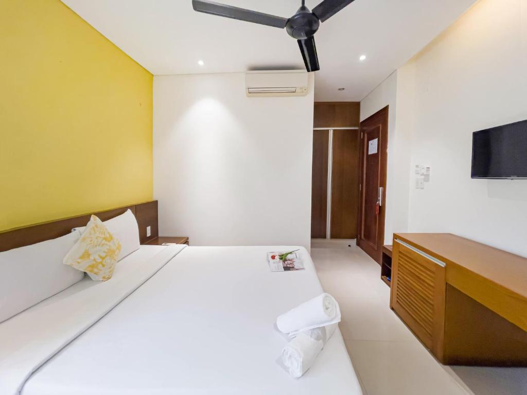 Voodi või voodid majutusasutuse Doha Central Bliss Danang Hotel by Haviland toas