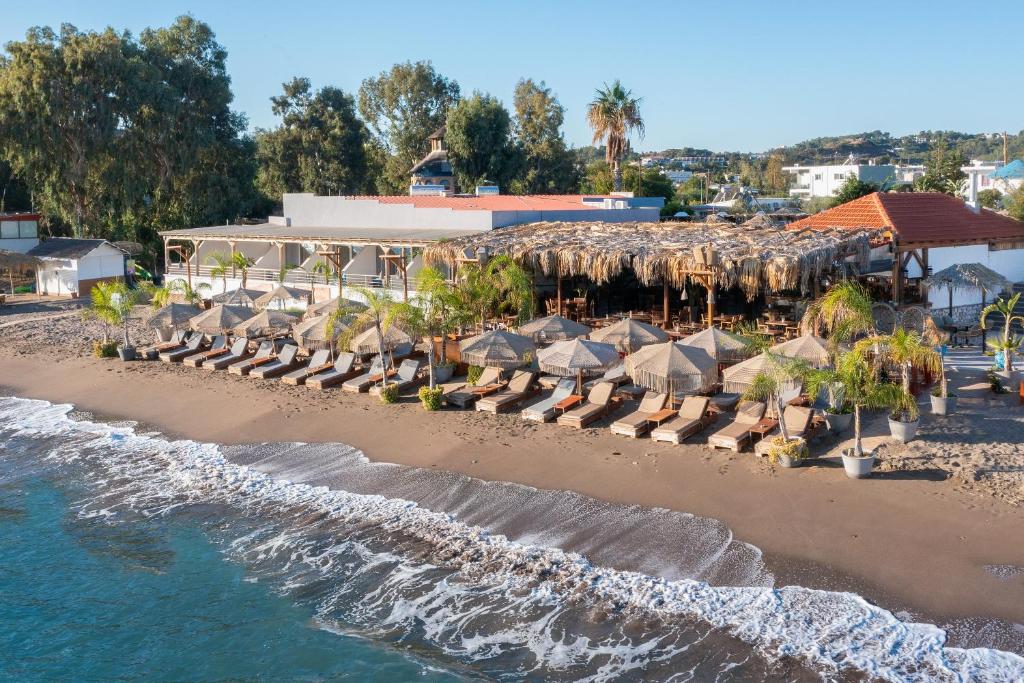 an aerial view of a beach with umbrellas and chairs at Aquarius Beach Hotel in Faliraki