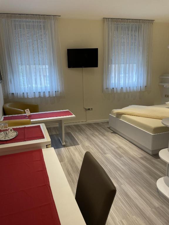 TV a/nebo společenská místnost v ubytování Hotel König Humbert