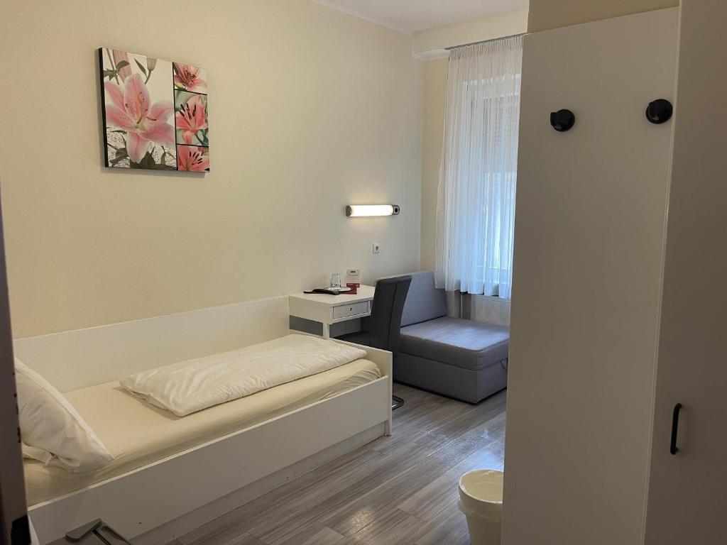 Postel nebo postele na pokoji v ubytování Hotel König Humbert