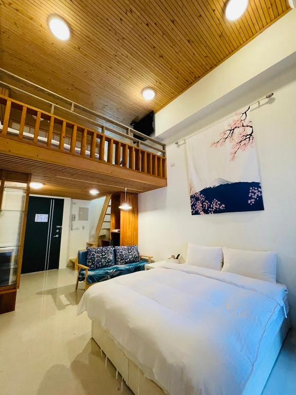 Postel nebo postele na pokoji v ubytování Qing Tang Hot Spring B&B