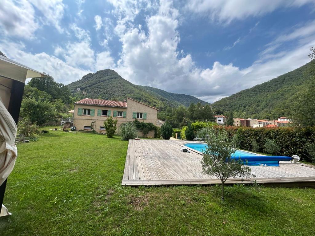 a house with a yard with a swimming pool at Villa de charme en Pays Catalan in Le Tech