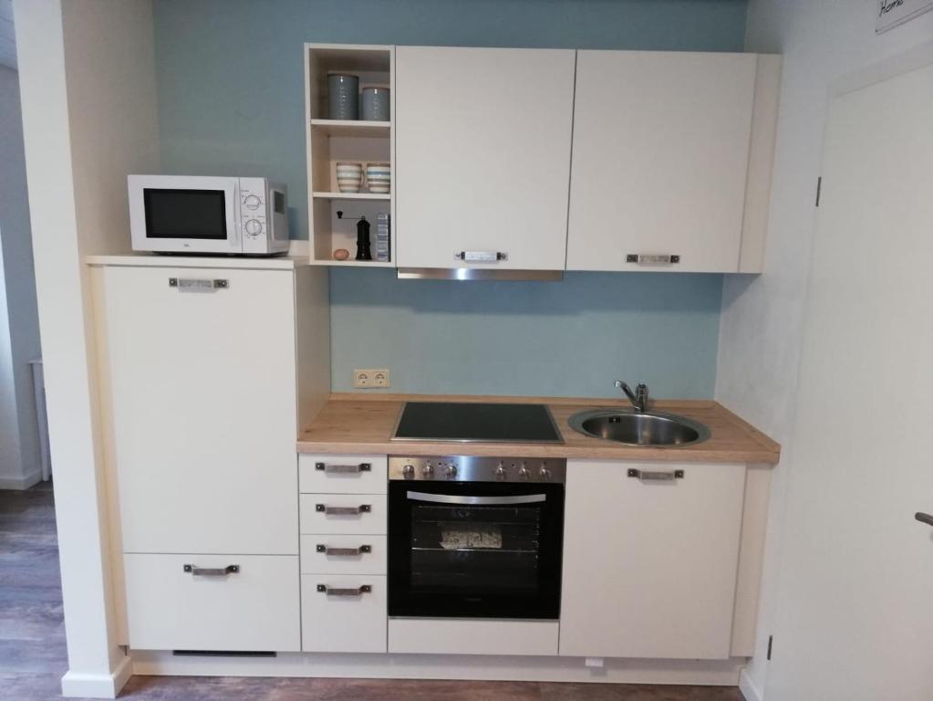 Kuchyň nebo kuchyňský kout v ubytování Gästehaus Becker