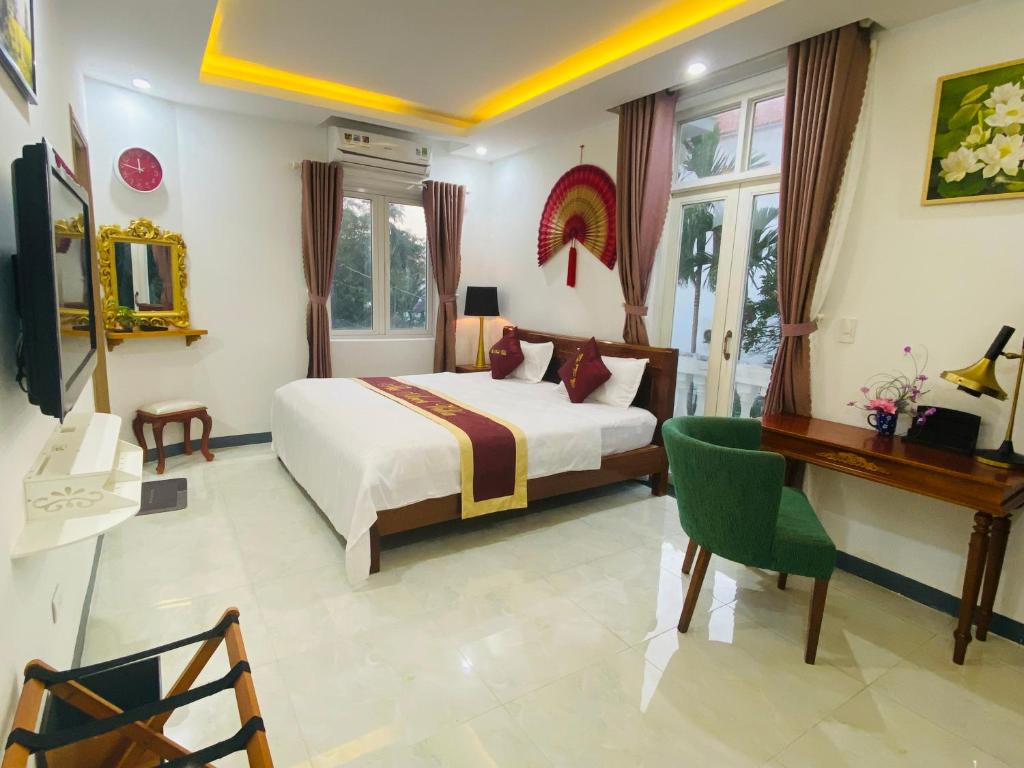Postel nebo postele na pokoji v ubytování The Arch Villa Hội An