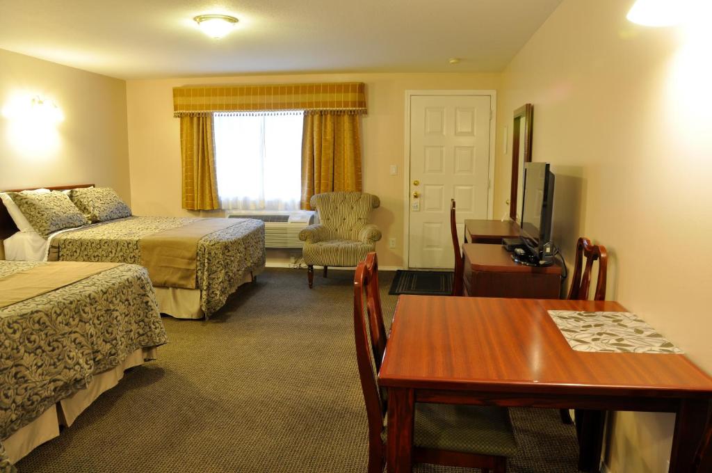 Postel nebo postele na pokoji v ubytování Rosedale Motel