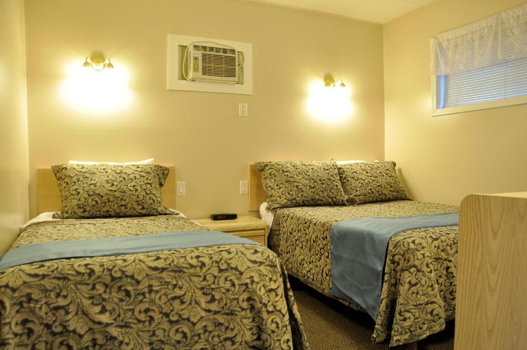 Postel nebo postele na pokoji v ubytování Rosedale Motel