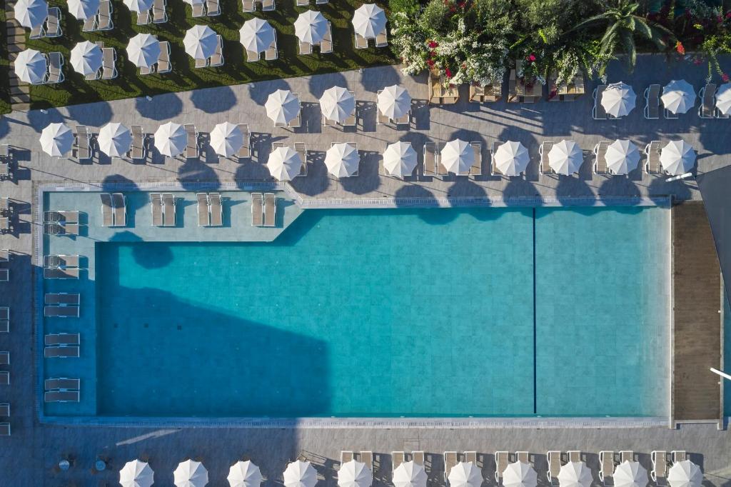 an overhead view of a swimming pool with chairs at Atlantica Sungarden Park in Ayia Napa