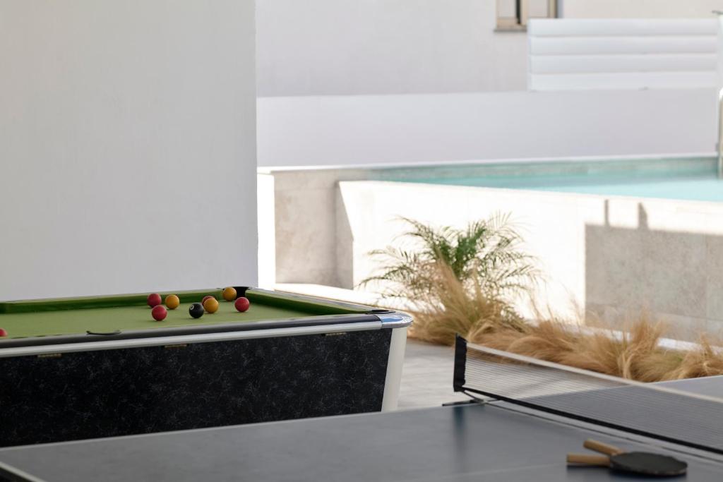 a pool table with balls on it in a room at Atlantica Sungarden Park in Ayia Napa
