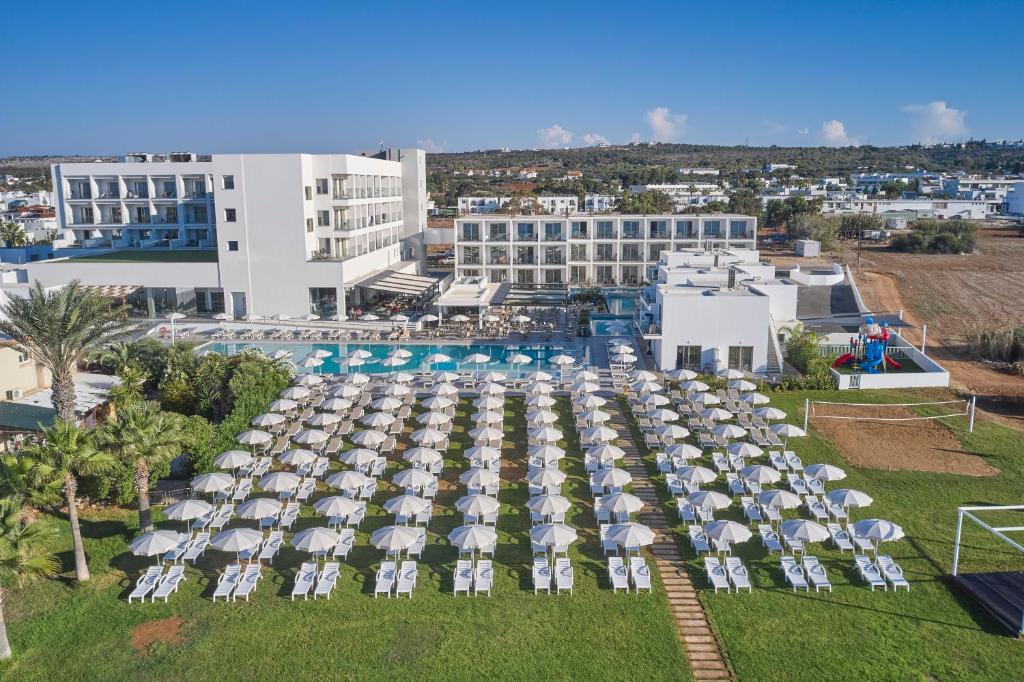 an aerial view of a resort with a pool and umbrellas at Atlantica Sungarden Park in Ayia Napa