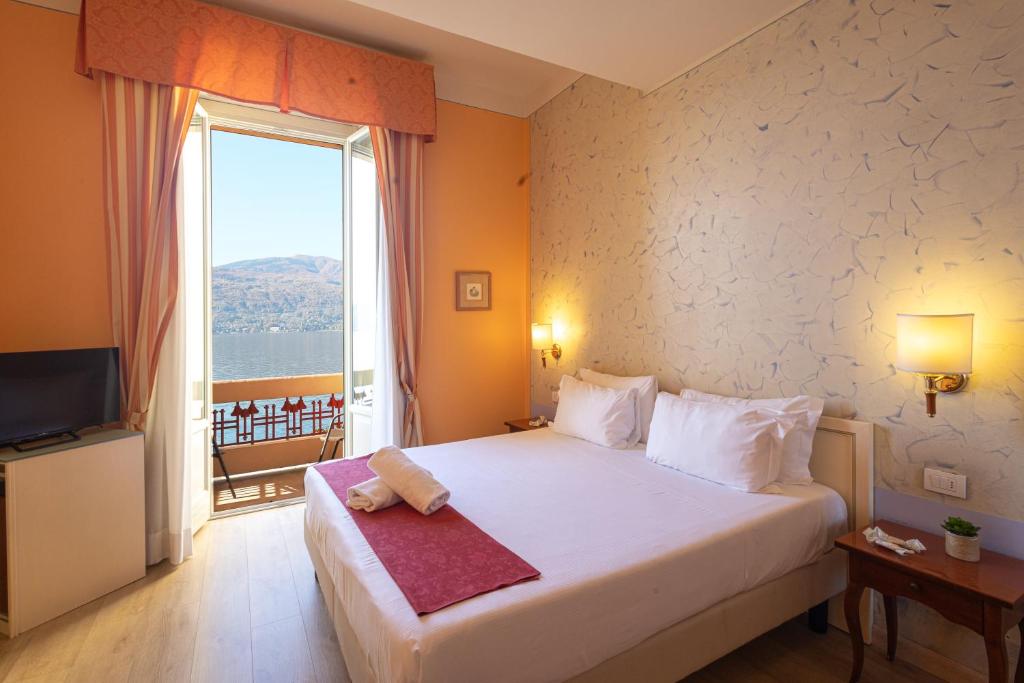 Postel nebo postele na pokoji v ubytování Hotel Pallanza by LVG Hotel Collection
