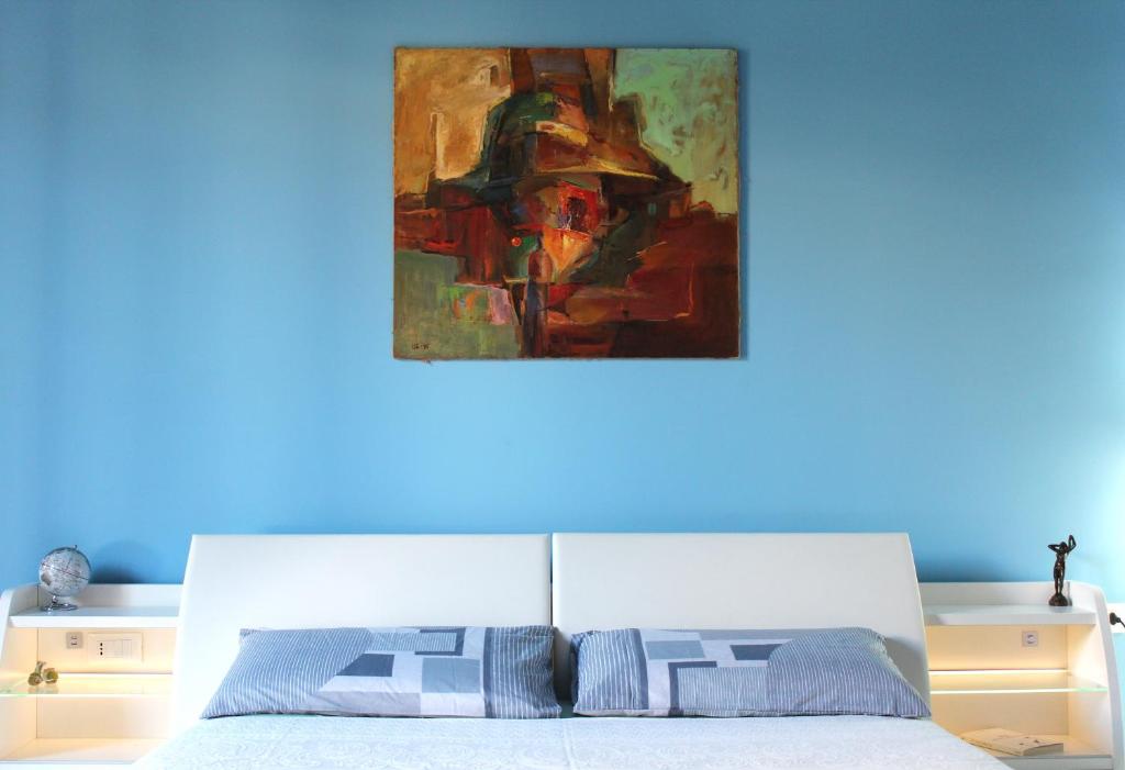 Postel nebo postele na pokoji v ubytování FALSTAFF Rooms & Suites