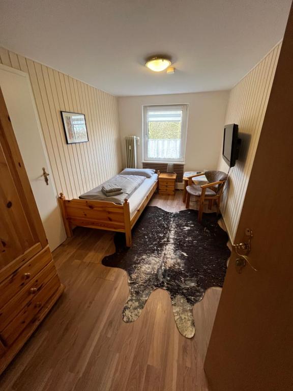 Postel nebo postele na pokoji v ubytování Hotel Mühleneck