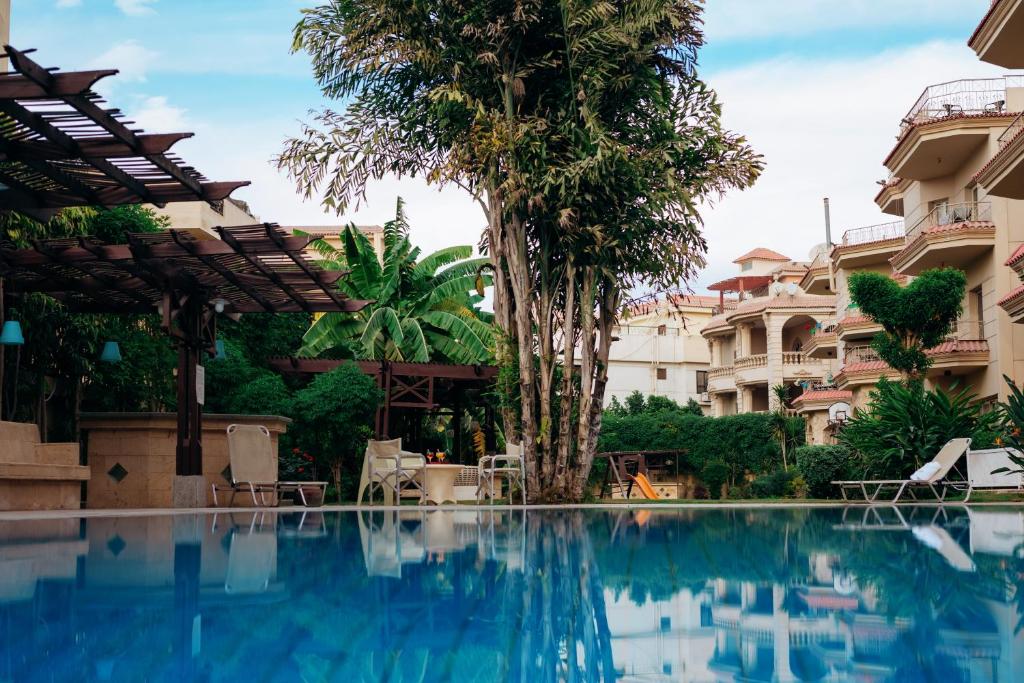 a view of a swimming pool at a hotel at The H Cairo Suites in Cairo
