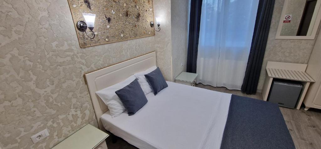 Postel nebo postele na pokoji v ubytování Florian Rooms