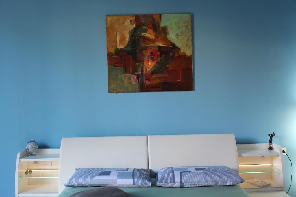 Postel nebo postele na pokoji v ubytování FALSTAFF Rooms & Suites