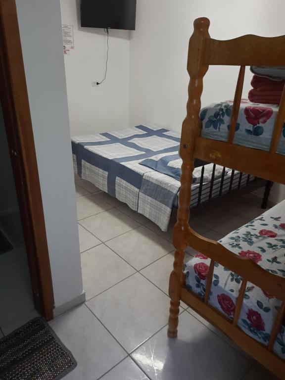 Postel nebo postele na pokoji v ubytování Hotel Pousada Guaratuba