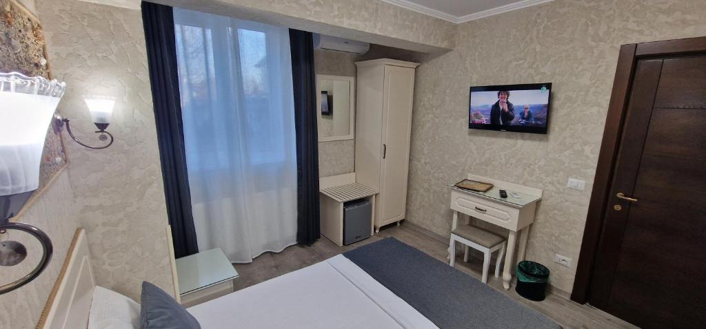 TV a/nebo společenská místnost v ubytování Florian Rooms