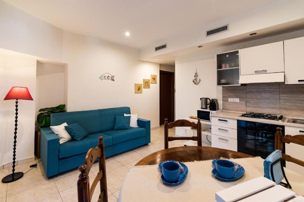 Kuchyň nebo kuchyňský kout v ubytování Appartamento Confortevole con posto auto gratuito e wifi