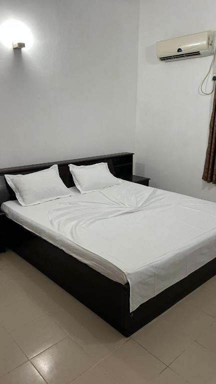 Postel nebo postele na pokoji v ubytování Himo Guest Inn