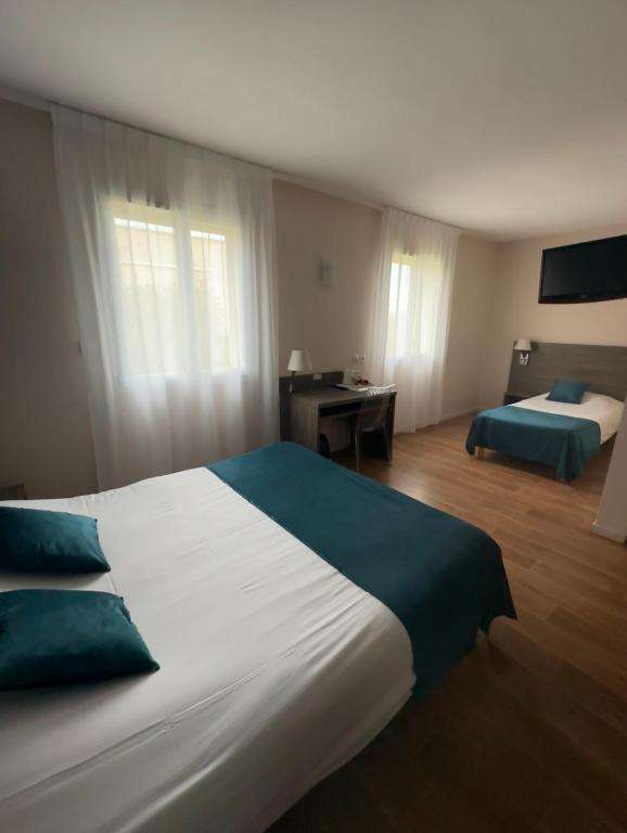 Postel nebo postele na pokoji v ubytování Hotel Caiman