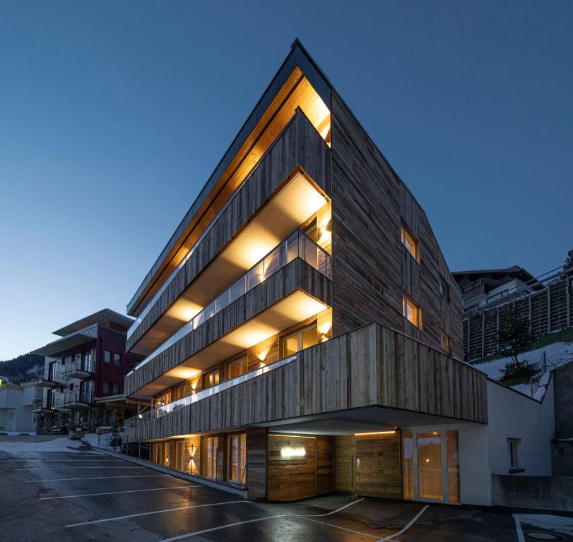a large building with lights on the side of it at Alpine Myth in Sankt Anton am Arlberg