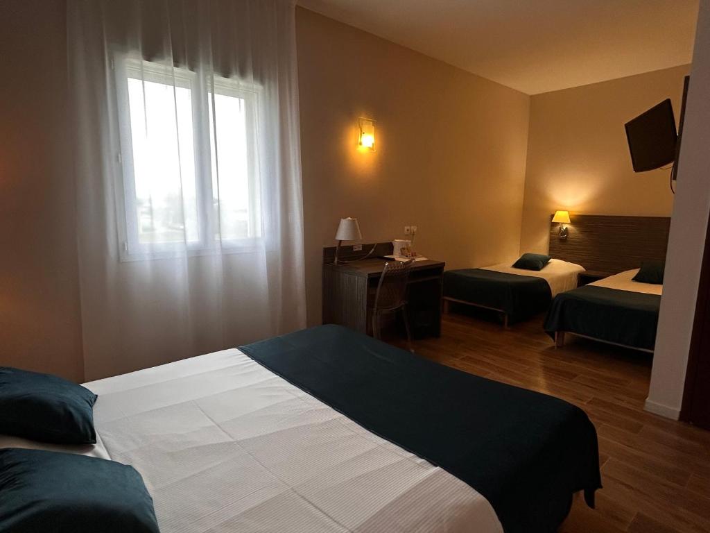 Postel nebo postele na pokoji v ubytování Hotel Caiman