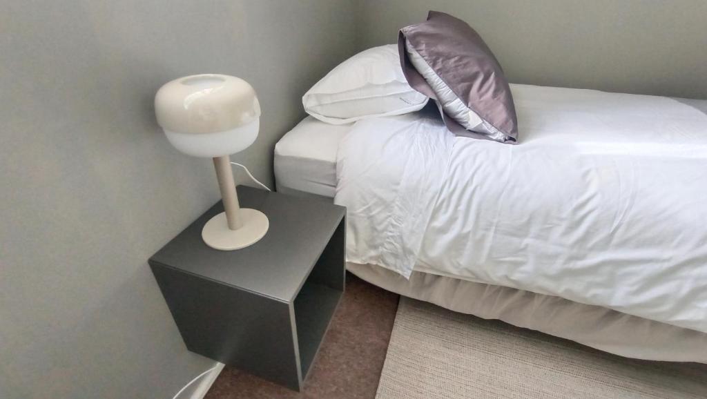 Postel nebo postele na pokoji v ubytování Hostal Florida Valpo