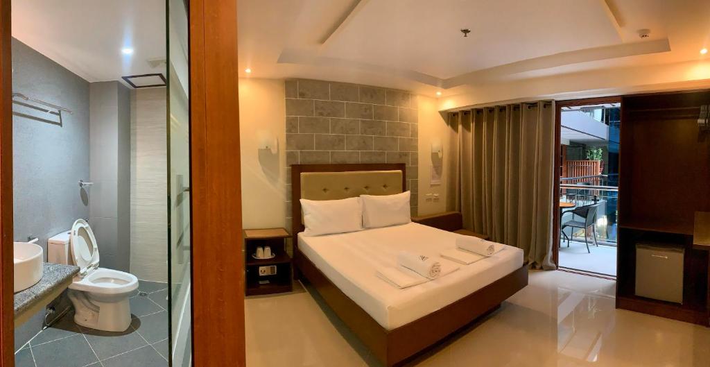 Postel nebo postele na pokoji v ubytování Panglao Alona Suites